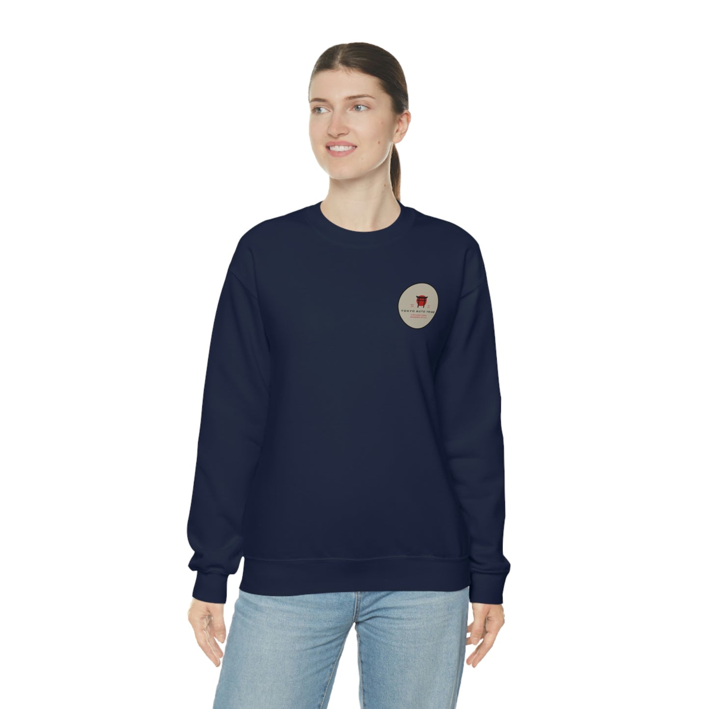 A woman wearing The Family Wagon Sweater in navy blue, featuring a small circular graphic emblem on the chest, embodying Japanese car culture and tuner-inspired streetwear style.