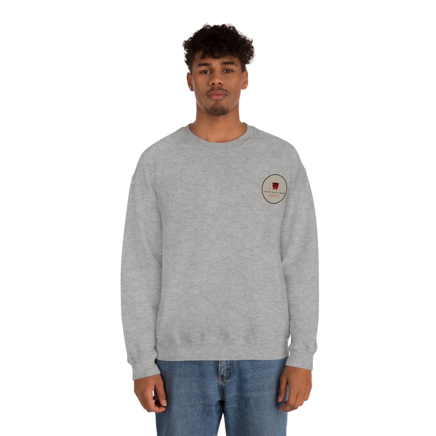 Man wearing a gray Wagon Chibi Sweater featuring a small graphic on the chest, styled for fans of Japanese car culture and late-night drives.