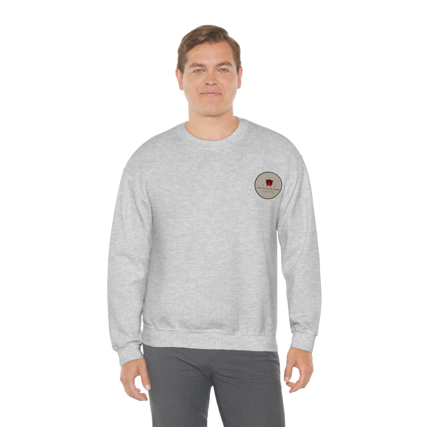 Man wearing a light gray Wagon Chibi Sweater featuring a small red graphic on the left chest, styled as casual automotive streetwear inspired by Japanese car culture.