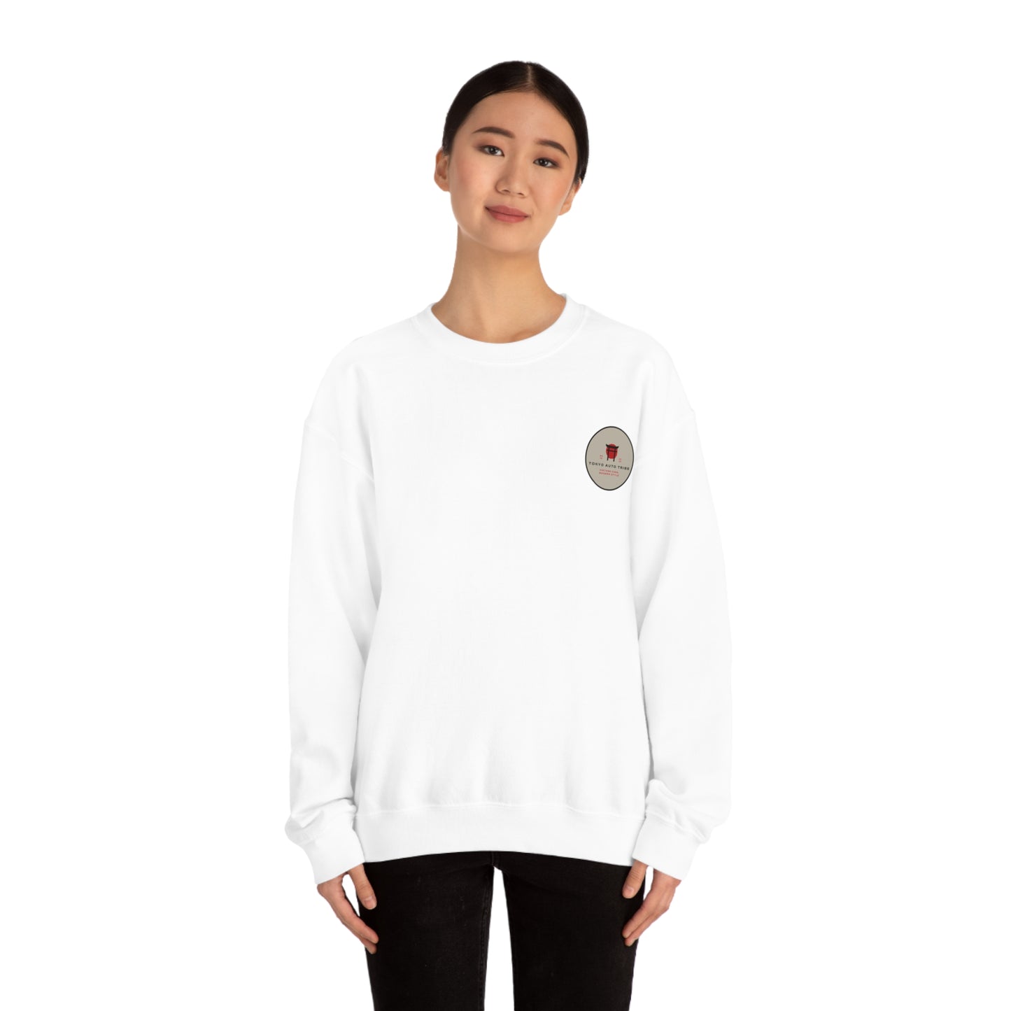 Young woman wearing a white Wagon Chibi Sweater with a small round chest graphic, styled casually for fans of Japanese car culture and streetwear.