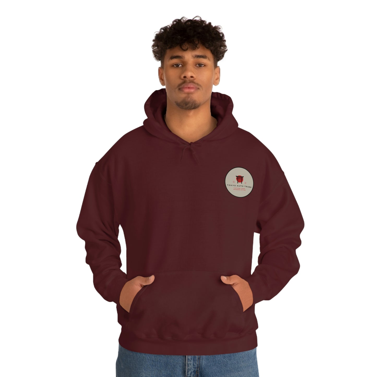Man wearing a maroon Groovy Grocery Runner Hoodie with a small circular logo on the chest, embodying Japanese car culture and drift-inspired streetwear style.