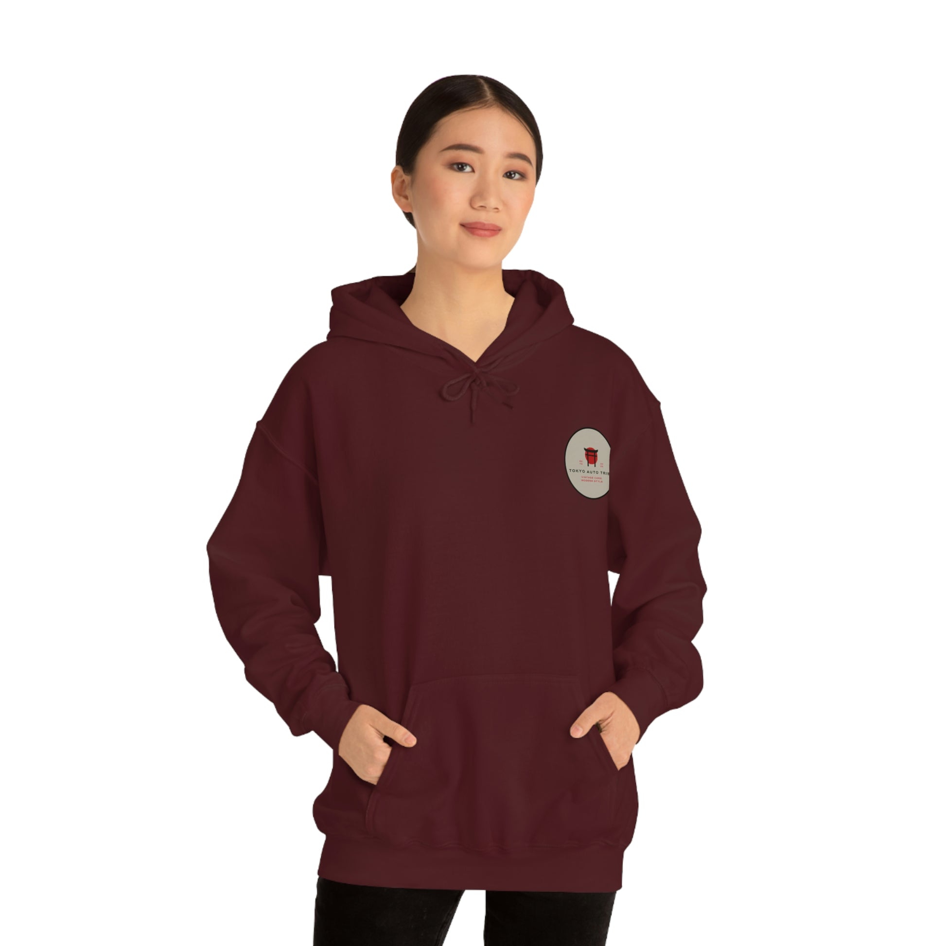 Woman wearing a maroon Groovy Grocery Runner Hoodie with a front pocket and a subtle graphic inspired by Japanese car culture, perfect for fans of late-night drives and tuner style.
