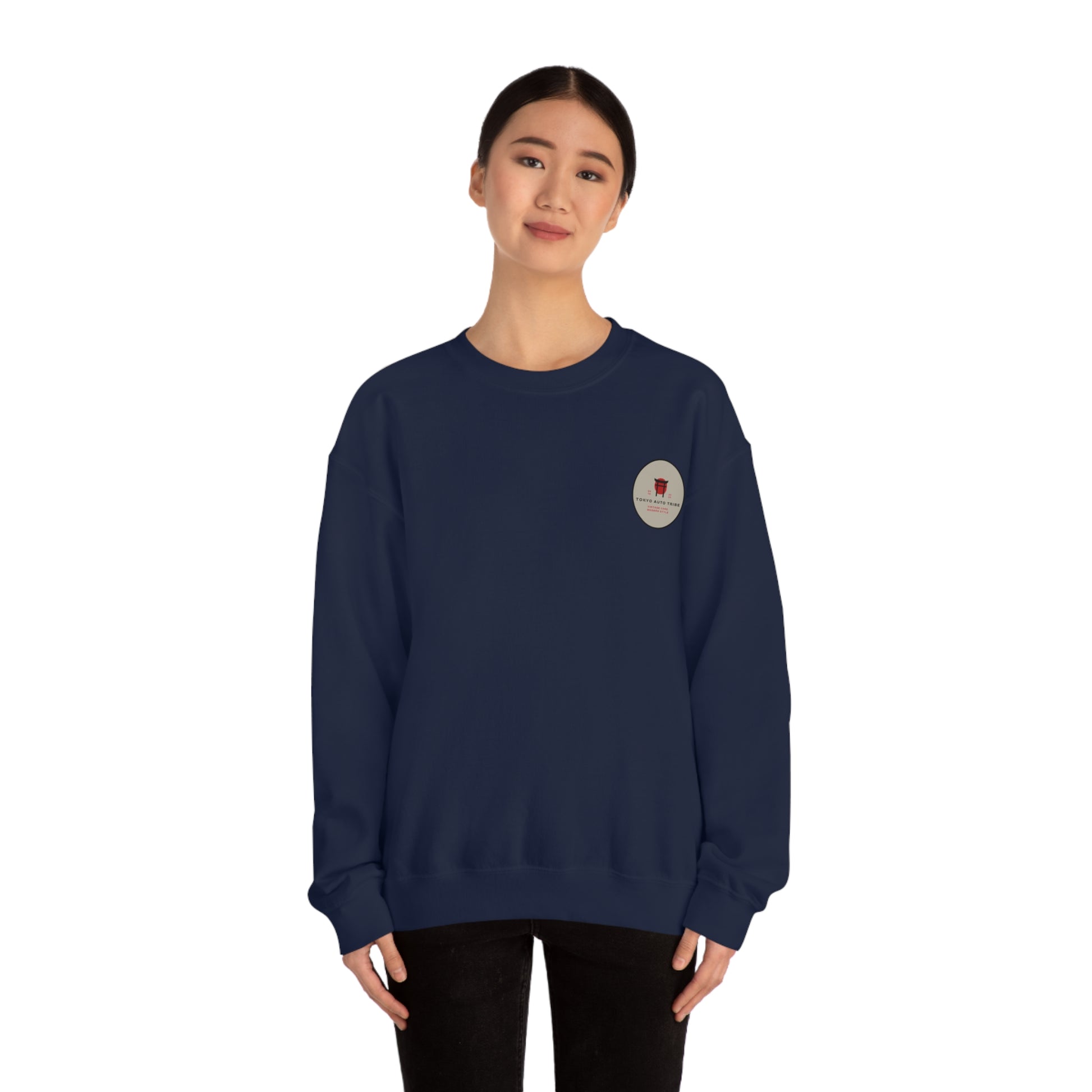 Woman wearing a navy blue Wagon Chibi Sweater with a small circular graphic on the chest, embodying Tokyo Auto Tribe’s Japanese tuner culture and late-night drive vibe.