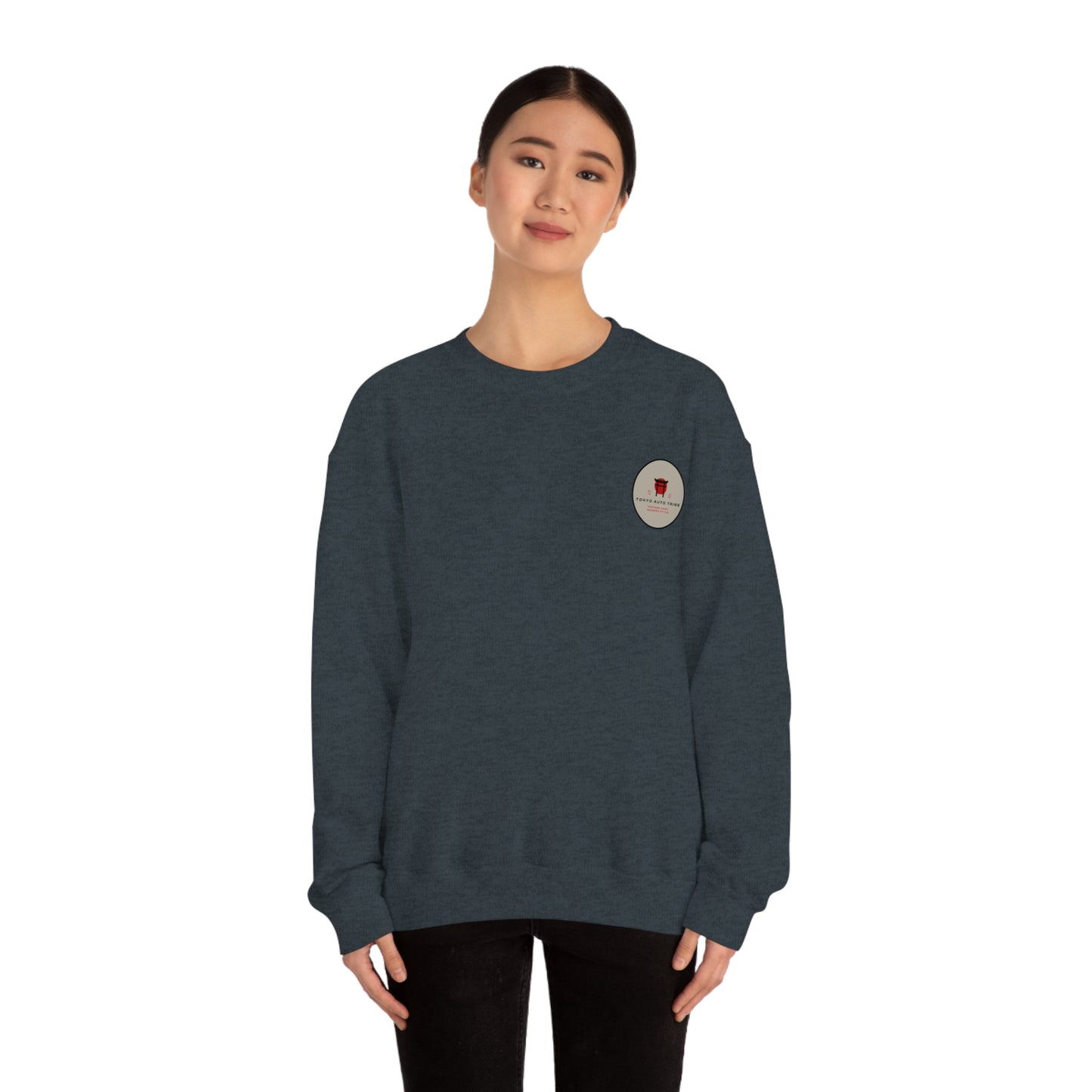 Woman wearing a dark blue Wagon Chibi Sweater with a small graphic emblem, embodying the spirit of Japanese car culture and late-night drives in comfortable streetwear.