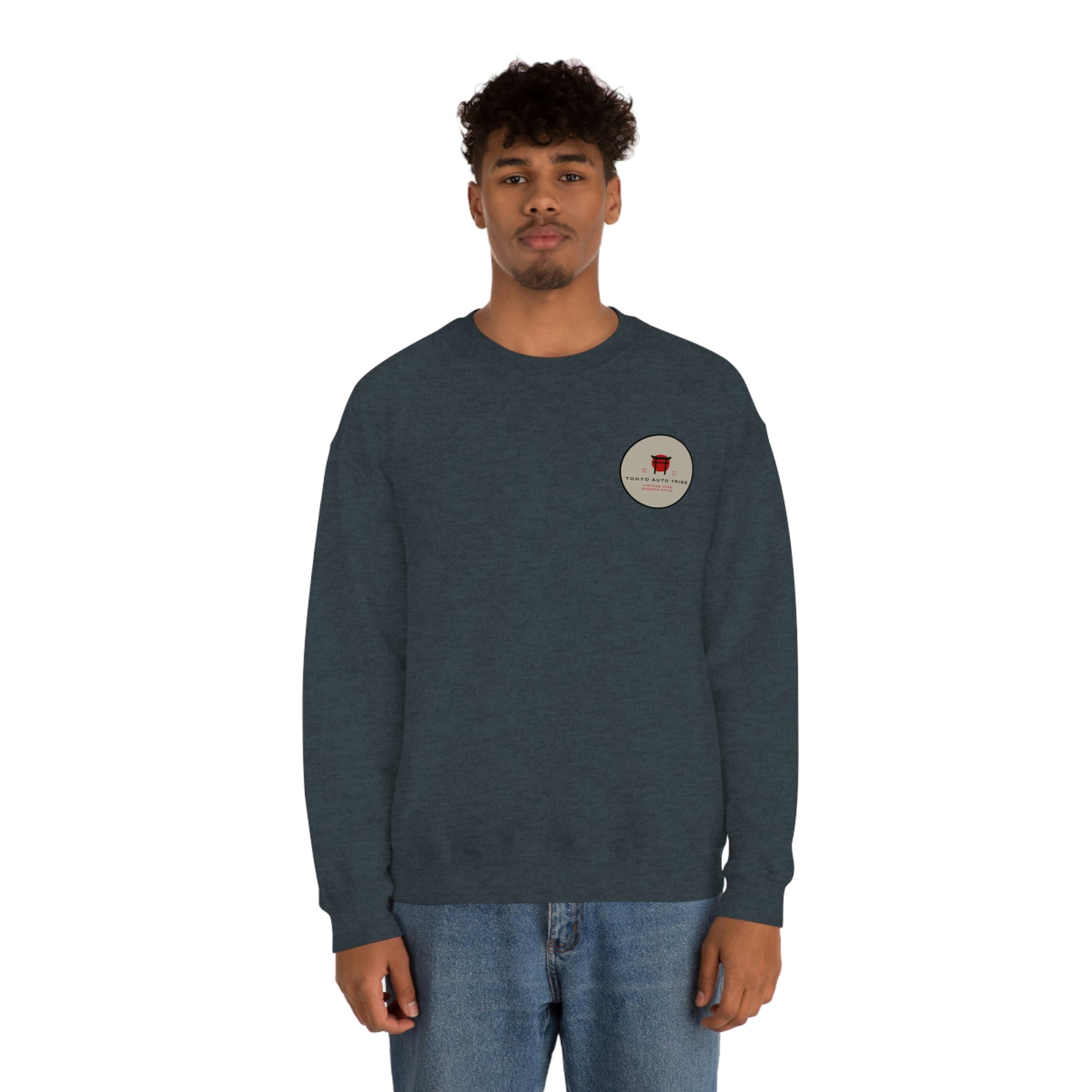 Man wearing The Family Wagon Sweater in dark blue, featuring a small round graphic on the chest embracing Japanese car culture inspired by late-night drives and tuner scene lifestyle.