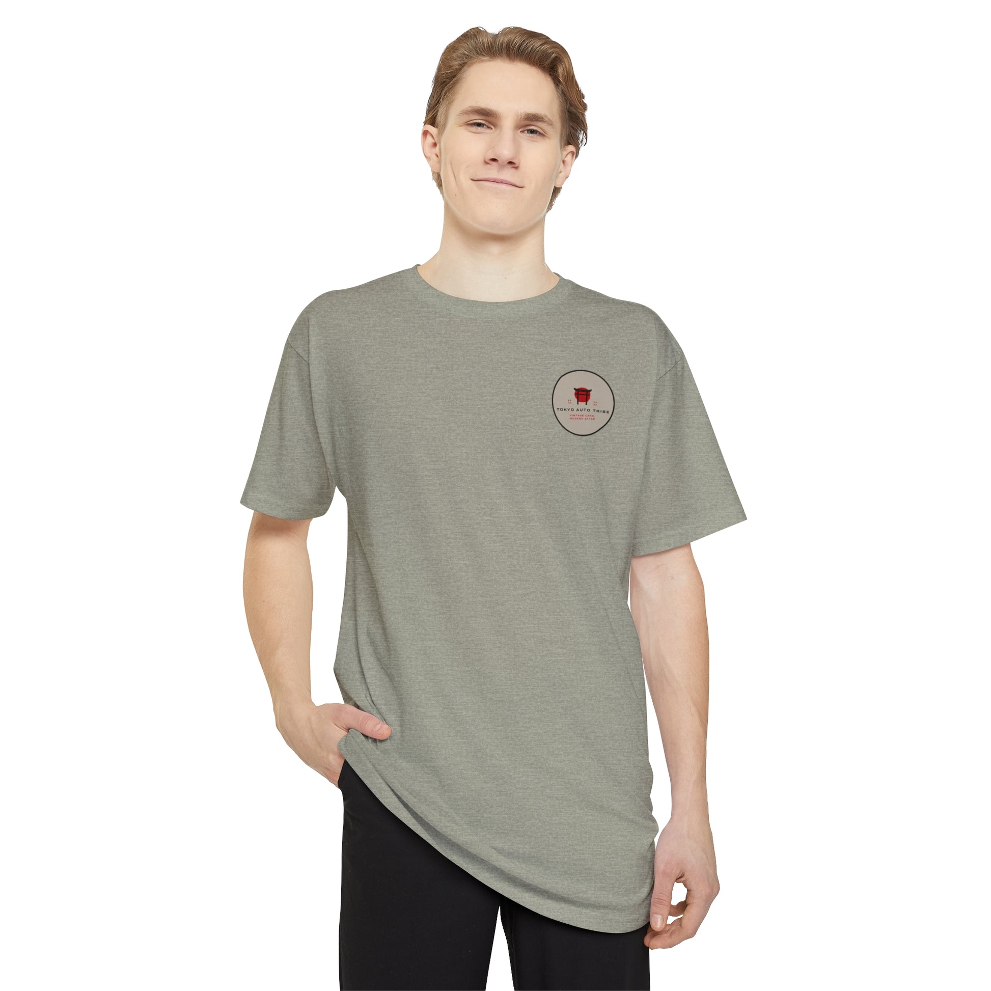 Young man wearing a gray Unbreakable Spirit oversized T-Shirt, embodying the late-night drives and Japanese car culture spirit with a relaxed fit and minimalist design.