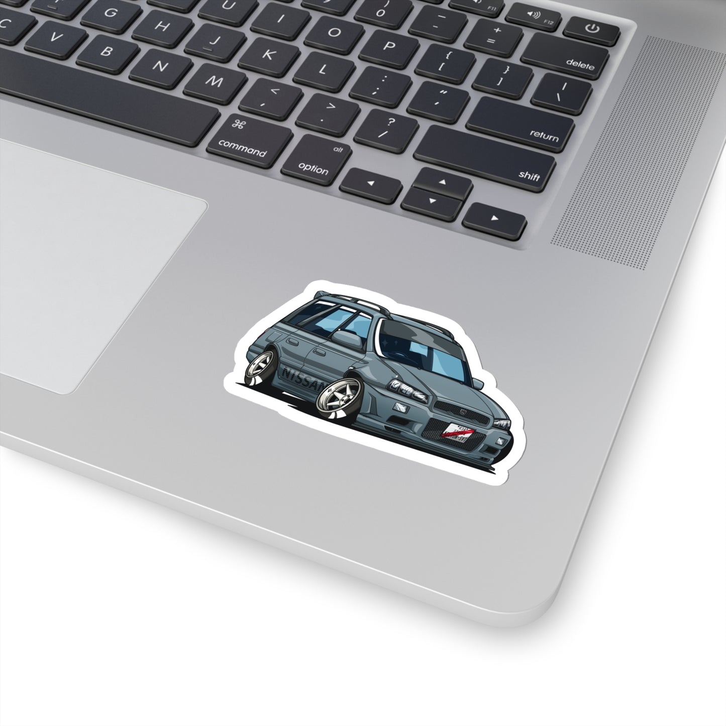 Wagon Wonder Sticker featuring a stylized gray vintage wagon car with lowered stance and tuner details, capturing the spirit of Japanese car culture and late-night drives.