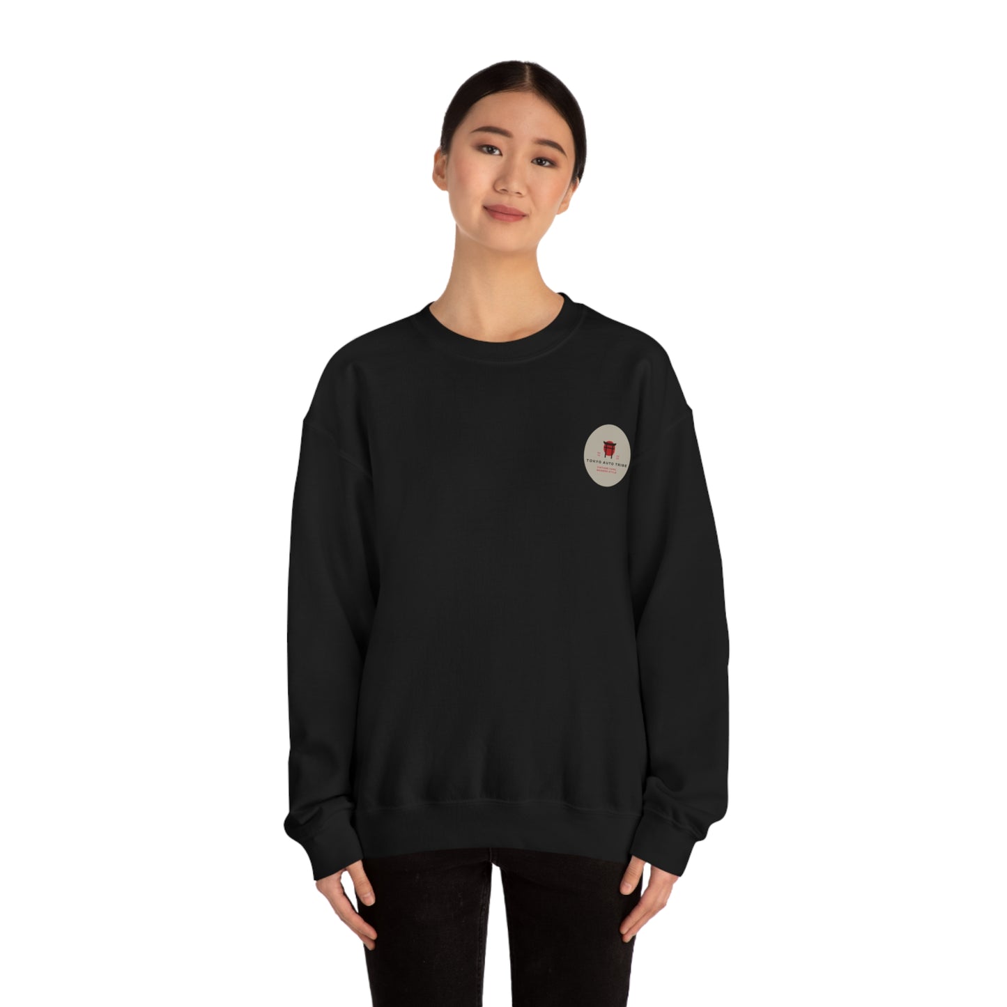 Young woman wearing a black Wagon Chibi Sweater with a small graphic logo on the chest, styled for fans of Japanese car culture, late night drives, and tuner scene fashion.