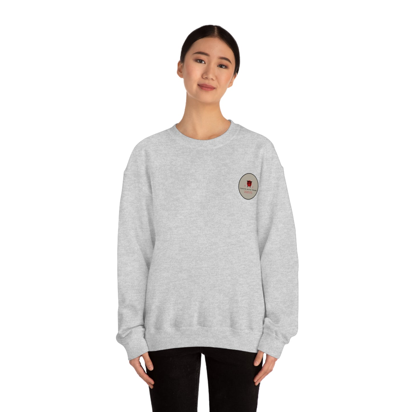 Woman wearing a light gray Wagon Chibi Sweater with a small, subtle graphic on the chest, styled for fans of Japanese car culture and late-night drives.