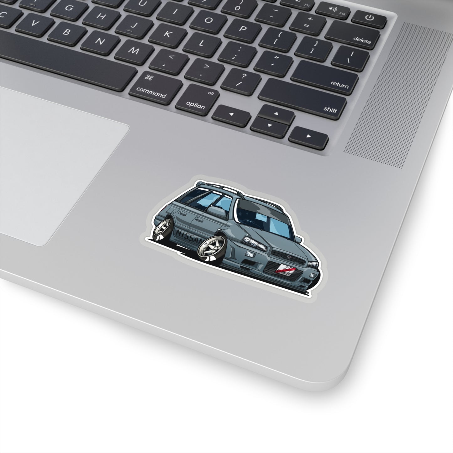 Wagon Wonder Sticker featuring a stylized, lowered Japanese station wagon with custom wheels, capturing late-night drive and tuner car culture vibes.