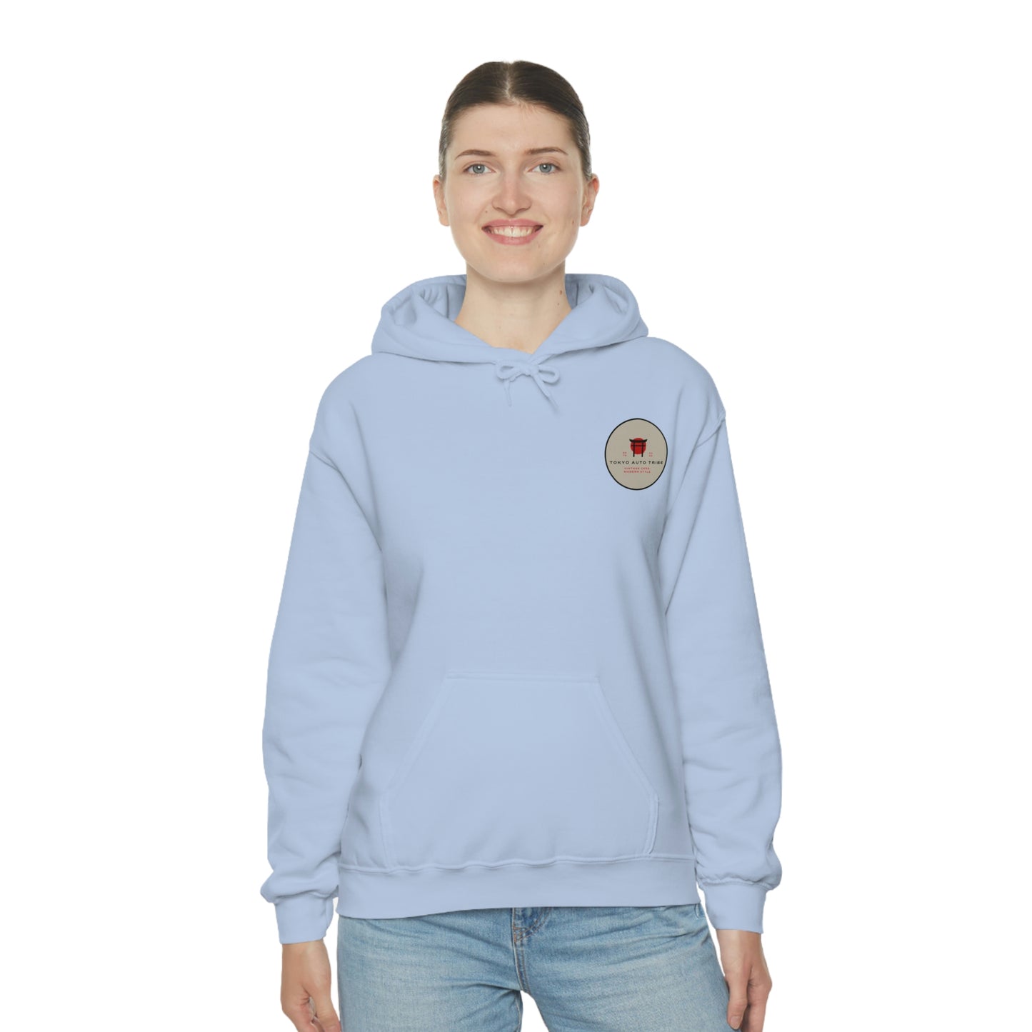 Smiling woman wearing a light blue Groovy Grocery Runner Hoodie with a small front graphic, styled for casual Japanese car culture and late-night drives enthusiasts.