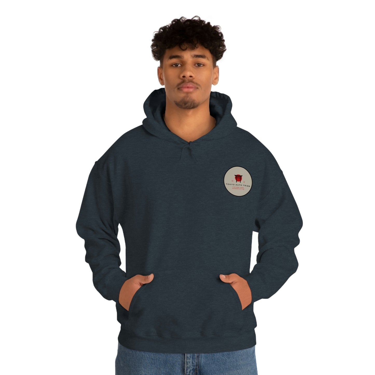 Man wearing a dark navy Groovy Grocery Runner Hoodie with a small circular logo on the chest, blending Japanese tuner culture and streetwear style.